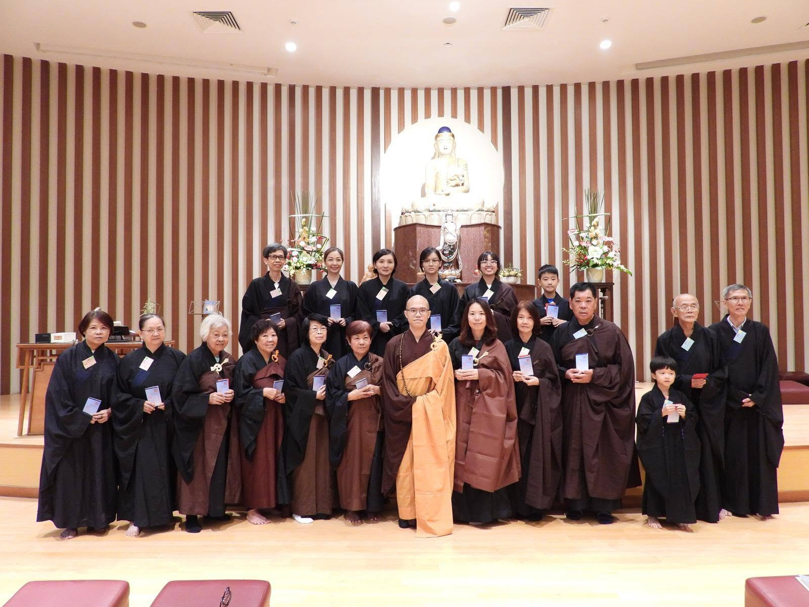 TMBS members with a monastic in the main hall